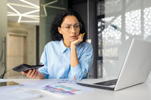 Financial Distortions in Your Business Reports concept with woman looking at report online